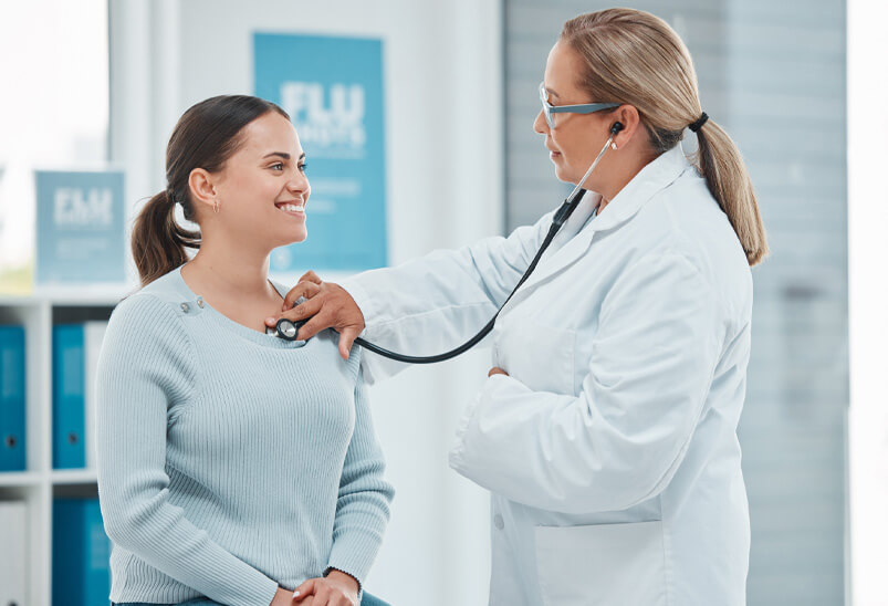 Doctor examining patient heartbeat